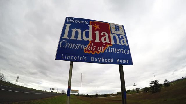Driving through Indianapolis, 'Welcome to Indiana' sign.