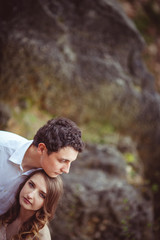 Obraz premium Sad woman leans to man's chest while he holds his chin on her he