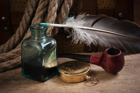 old pocket watch and inkwell
