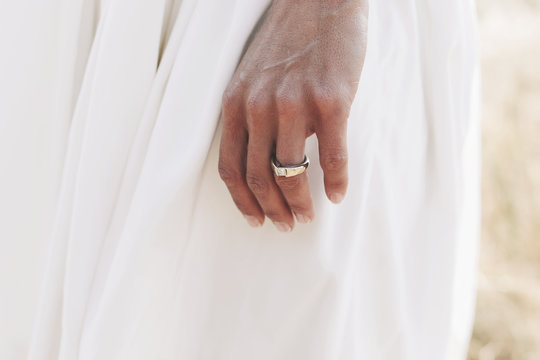 A Bride's Hand Wearing A Wedding Ring