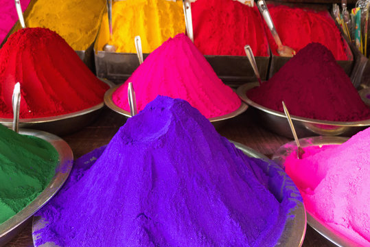 Conical piles of kumkum (coloured powder used for bindi dots and pujas) at devaraja market;Mysore karnataka india