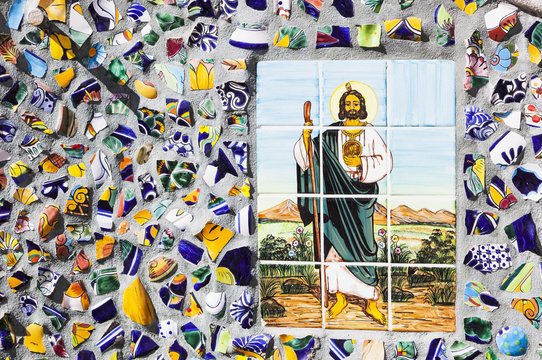 Jesus is depicted in a colour tile mosiac on a street;Puerto vallarta mexico