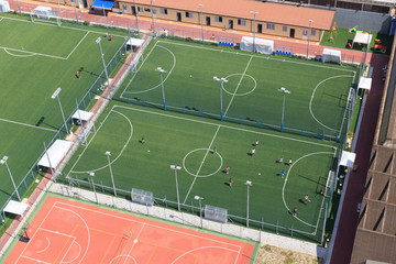 Obraz premium Urban soccer pitch, soccer school Child