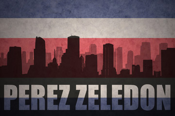 Fototapeta premium abstract silhouette of the city with text Perez Zeledon at the vintage costa rican flag