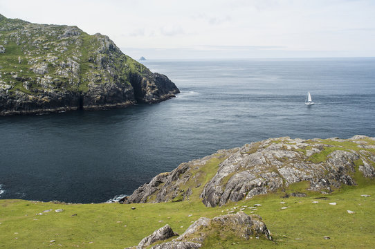 Yacht sailing into dursley sound;Beara peninsula, county kerry, ireland