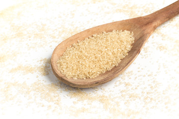Demerara Sugar into a spoon