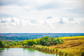 Obraz premium landscape, pond and forest on the hills, nature background