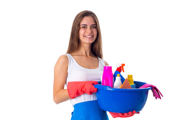 Woman holding cleaning things in washbowl