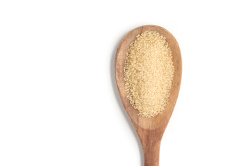 Demerara Sugar into a spoon