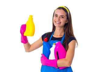 Woman in apron holding a detergents