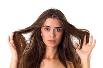 Woman touching her tangled hair