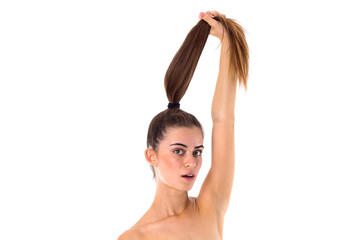 Woman holding her long ponytail