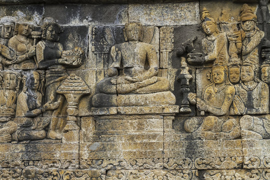 Bas-relief depicting the life of Buddha on a gallery of Candi Borubudur, Borobudur Temple Compounds, Central Java, Indonesia