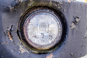 Old Headlight / Close-up of headlight, vintage color tone picture / headlight of a oldtimer / Color...