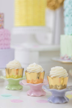 Rows of cupcakes on dessert table; Toronto, Ontario, Canada