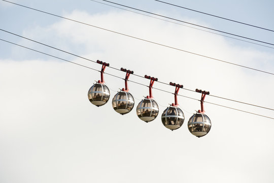 Bubble gondola against blue sky and white cloud; Grenoble, France