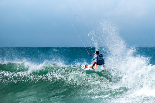 Amazing kite surfing at Philippines. Processional instructor surfing in ocean waives