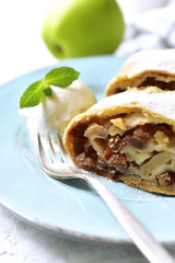 Apple strudel with raisins and walnuts.