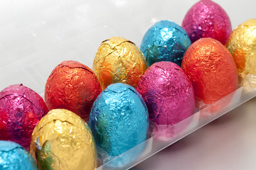 Obraz na płótnie Canvas Container of multicoloured Easter eggs