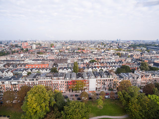 Fototapeta na wymiar Aerial view of Amsterdam city roofs beside Sarphati park 