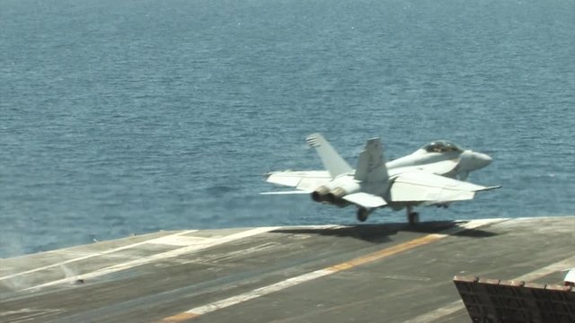 F/A-18 take off, F/A-18 fighter jet takes off of the U.S.S Dwight, D, Eisenhower Aircraft Carrier.