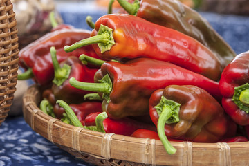 Basket of red bell peppers.