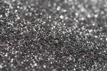 Glittery gray background with bokeh effect