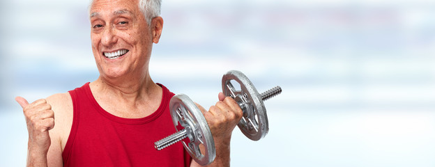 Naklejka premium Senior man with dumbbell.