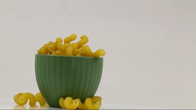 Rotating Cavatappi pasta in a bowl
