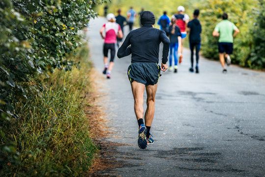 Male Runner Of Average Years Running Marathon In Fall City Park