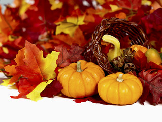 Naklejka na ściany i meble Two Mini Pumpkins with Fall Colored Leaves