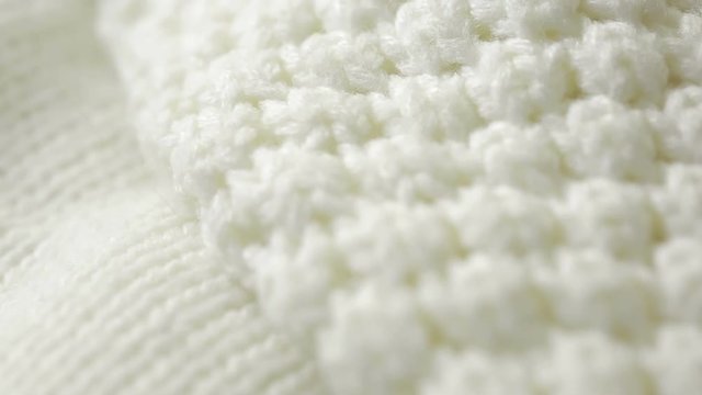 white knitted wool texture. use as background. close-up