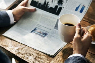 Reading Morning Paper Coffee Concept