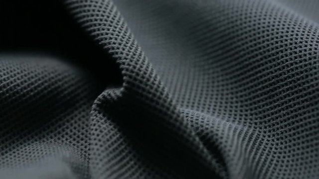 mesh cloth. black synthetic fabric. can be used as a background