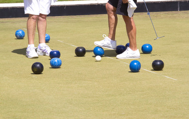Bowls or lawn bowls is a sport played on outdoor lawn which is natural grass or artificial turf. The objective of the game is to roll biased balls to stop close to a smaller ball jack or kitty.