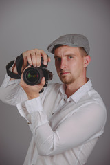 Young man using a professional camera