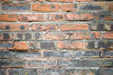 Old, crumbly and burnt bricks wall. Background.