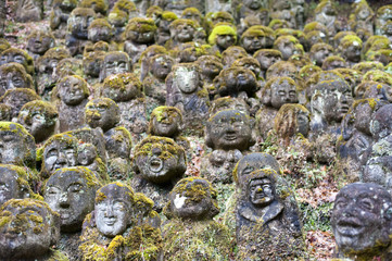 moss covered stone figures