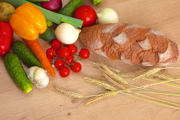 Pile of organic vegetables on a wooden table