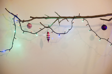 Bare Tree Branch with Christmas Decorations