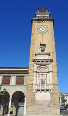 Fototapeta premium Bergamo, Lombardy, Italy. One of the beautiful city in Italy. The memorial tower in the city center, downtown. Located in Vittorio Veneto place, at the begin of the pedestrian boulevard.