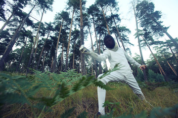 Training of a swordsman in the forest