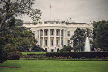 Fototapeta na wymiar The White House in Washington D.C. at a cloudy day, Executive Office of the President of the United States, Vintage filtered style