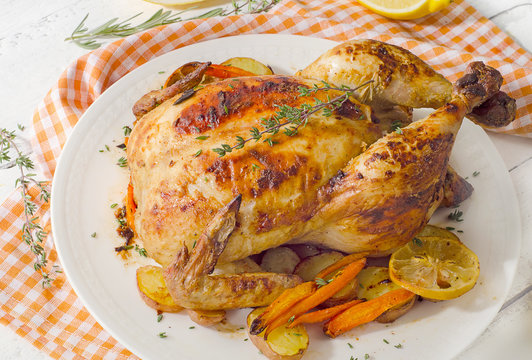Whole roasted chicken with vegetables