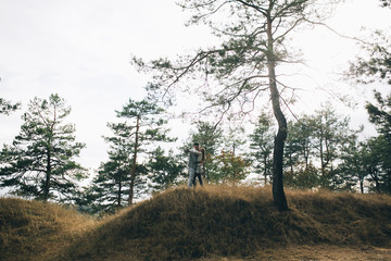 Obraz premium Stylish and fashionable young beautiful happy couple posing. Boho style.