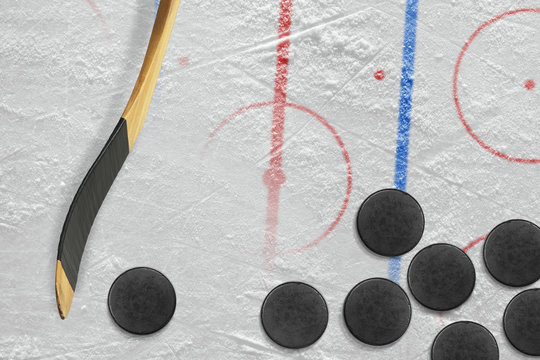 Sticks, pucks and hockey field with markings