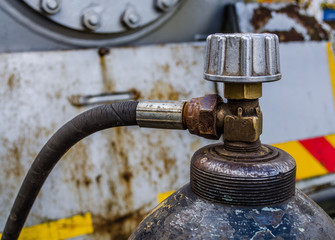 gas oxygen cylinders close up / a welding gas cylinder pressure gauge / gas cylinder valve / Scuba air tanks with valves / Pressurized gas cylinder,CO2 gas venting to release pressure