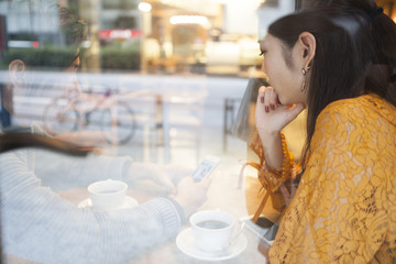 Glass through a window of a couple
