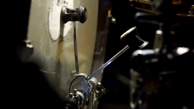 Bass drum pedal in action. Single kicks in the bass drum. Close-up footage. Looped video