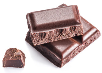 Pieces of chocolate bar isolated on a white background.